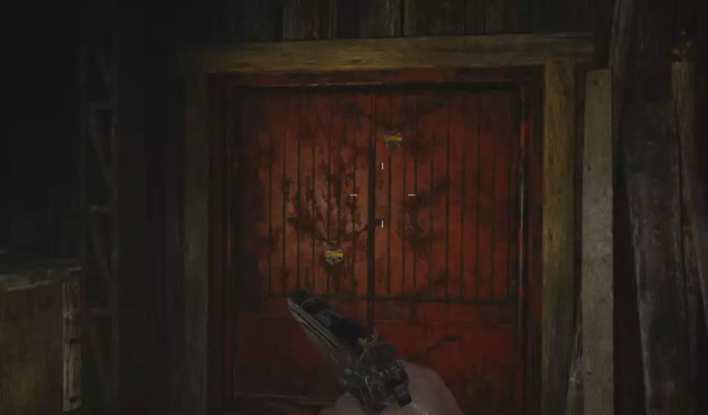 Замки на двери, охраняемой каннибалом. Источник: Capcom